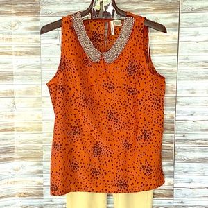Sleeveless blouse with beaded collar
